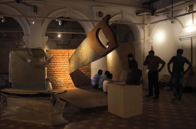 In this Aug. 12, 2017, workers stand around a giant saw installation that is cutting through a brick wall at the Partition Museum that is set to open later this week in Amritsar, India, 32 kilometres (20 miles) from border with Pakistan. (AP) In this Aug. 12, 2017, workers stand around a giant saw installation that is cutting through a brick wall at the Partition Museum that is set to open later this week in Amritsar, India, 32 kilometres (20 miles) from border with Pakistan. (AP)