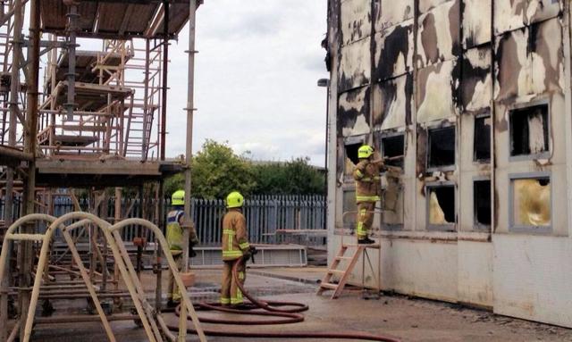 Firefighters battle the blaze at the airport. (Twitter)