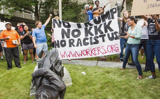 Protesters celebrate after toppling a statue of a Confederate solder in Durham, N.C. Monday, Aug. 14, 2017. (AP) Protesters celebrate after toppling a statue of a Confederate solder in Durham, N.C. Monday, Aug. 14, 2017. (AP)