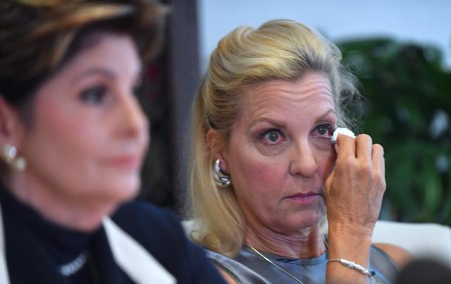 Attorney Gloria Allred (L) addresses the media as Robin (one name), another accuser of Roman Polanski who alleges she was 16 years old when sexually victimized by Mr. Polanski, wipes a tear from her eye, during a press conference in Los Angeles, California. (AFP) Attorney Gloria Allred (L) addresses the media as Robin (one name), another accuser of Roman Polanski who alleges she was 16 years old when sexually victimized by Mr. Polanski, wipes a tear from her eye, during a press conference in Los Angeles, California. (AFP)