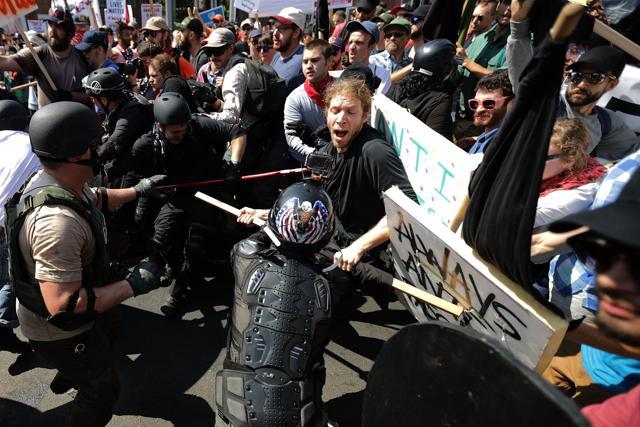 White nationalists, neo-Nazis and members of the "alt-right" (L) clash with counter-protesters as they enter Emancipation Park during the Unite the Right rally August 12, 2017 in Charlottesville, Virginia. (AFP) White nationalists, neo-Nazis and members of the "alt-right" (L) clash with counter-protesters as they enter Emancipation Park during the Unite the Right rally August 12, 2017 in Charlottesville, Virginia. (AFP)