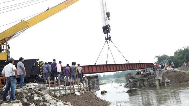 Work on restoration of railway bridge at Fakiragram, Assam, damaged by flood. (Northeast Frontier Railway) Work on restoration of railway bridge at Fakiragram, Assam, damaged by flood. (Northeast Frontier Railway)