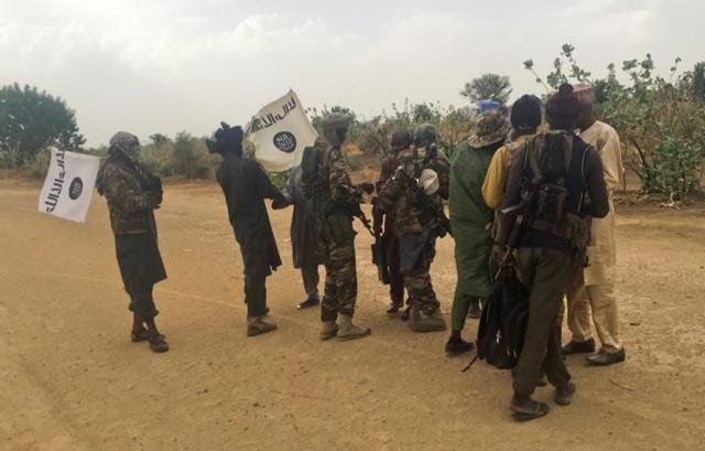 Boko Haram militants (in camouflage) embrace and shake hands with Boko Haram prisoners, released in exchange for a group of 82 Chibok girls, who were held captive for three years by Islamist militants, near Kumshe, Nigeria, May 6, 2017. Picture taken May 6, 2017. (Reuters File Photo) Boko Haram militants (in camouflage) embrace and shake hands with Boko Haram prisoners, released in exchange for a group of 82 Chibok girls, who were held captive for three years by Islamist militants, near Kumshe, Nigeria, May 6, 2017. Picture taken May 6, 2017. (Reuters File Photo)