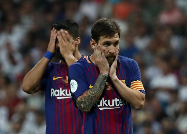 Barcelona's Lionel Messi and Luis Suarez look dejected after losing to Real Madrid in the Super Cup decider. (REUTERS) Barcelona's Lionel Messi and Luis Suarez look dejected after losing to Real Madrid in the Super Cup decider. (REUTERS)