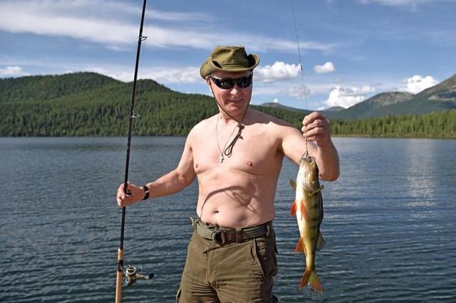 Putin holds a fish he caught during the hunting and fishing trip in the republic of Tyva in southern Siberia, Russia. (Reuters) Putin holds a fish he caught during the hunting and fishing trip in the republic of Tyva in southern Siberia, Russia. (Reuters)