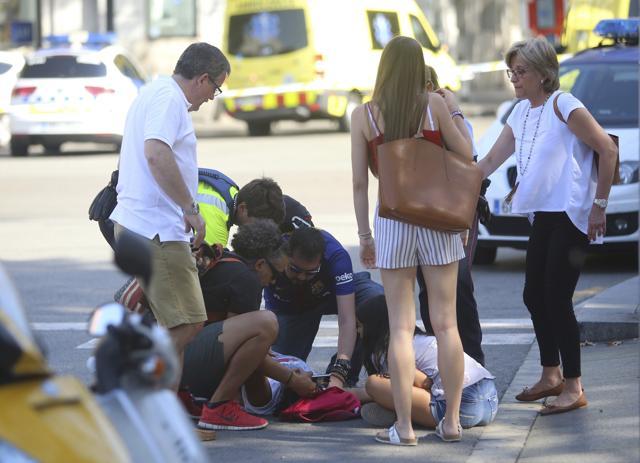 An injured person is treated in Barcelona, Spain after a white van jumped the sidewalk in the historic Las Ramblas district, crashing into a summer crowd of residents and tourists and injuring several people, police said. (AP Photo) An injured person is treated in Barcelona, Spain after a white van jumped the sidewalk in the historic Las Ramblas district, crashing into a summer crowd of residents and tourists and injuring several people, police said. (AP Photo)