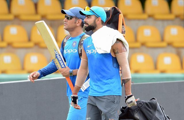 Virat Kohli (R) with former India captain Mahendra Singh Dhoni during a practice session at The Rangiri Dambulla International Cricket Stadium in Dambulla. (AFP) Virat Kohli (R) with former India captain Mahendra Singh Dhoni during a practice session at The Rangiri Dambulla International Cricket Stadium in Dambulla. (AFP)