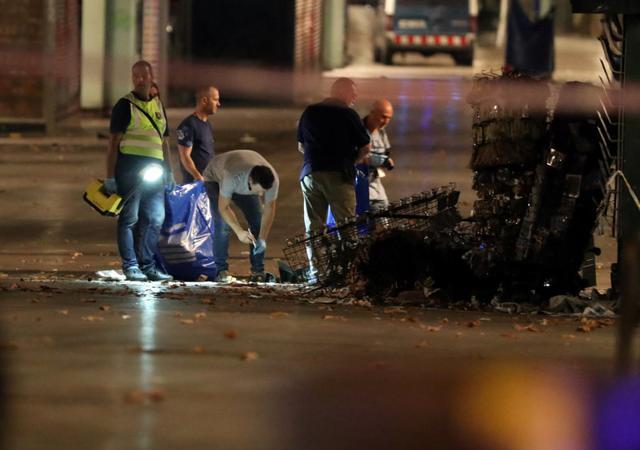 Forensic police officers search for clues near the area where a van crashed into pedestrians at Las Ramblas in Barcelona. (Reuters) Forensic police officers search for clues near the area where a van crashed into pedestrians at Las Ramblas in Barcelona. (Reuters)