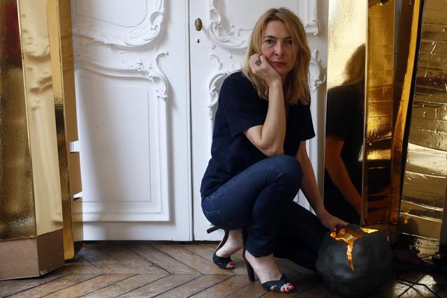 French lighting designer Odile Soudant poses next to her creations in her studio in Paris. (AP) French lighting designer Odile Soudant poses next to her creations in her studio in Paris. (AP)
