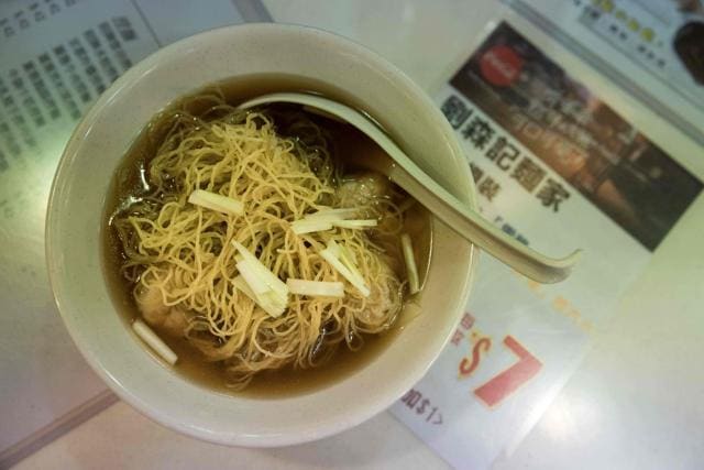 A bowl of noodles, handmade using a traditional bamboo pole technique, at a restaurant in Hong Kong. (AFP)