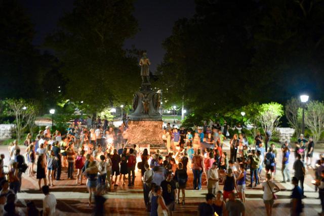 Charlottesville community members leave candles and flowers at the base of a statue of Thomas Jefferson north of University of Virginia's Rotunda at a vigil for Heather Heyer following last Saturday's protest organised by white nationalists in Charlottesville, Virginia. (Reuters)