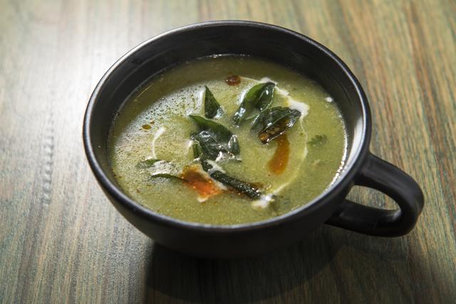 Descriptions at South High are loose. The Mysore chicken soup is described as having creamy coconut and turmeric. What arrives is a slightly chunky concoction, jade green from cilantro. (Aalok Soni / HT Photo)
