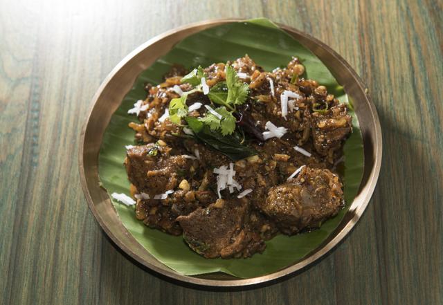 Kerala mutton pepper fry’s spice is softened with coconut milk as promised, but its large chunks of sinewy meat are unyielding rubber. (Aalok Soni / HT Photo)