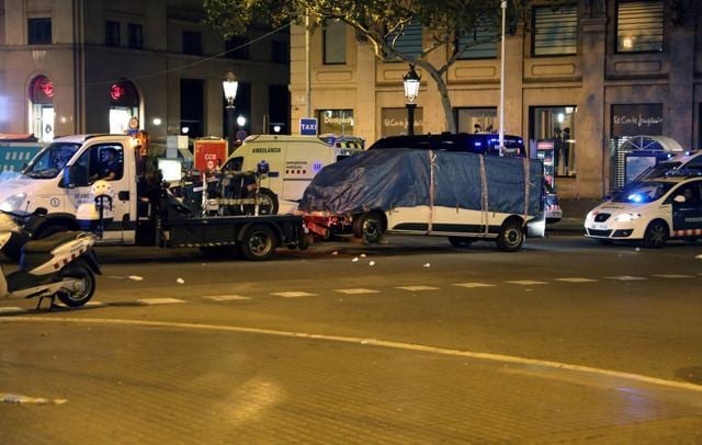 The suspected van is towed away from the area where it crashed into pedestrians at Las Ramblas in Barcelona. (Reuters) The suspected van is towed away from the area where it crashed into pedestrians at Las Ramblas in Barcelona. (Reuters)