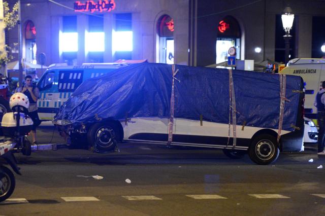 The van which ploughed into the crowd, killing at least 13 people and injuring around 100 others, is towed away from the Rambla in Barcelona. (AFP Photo) The van which ploughed into the crowd, killing at least 13 people and injuring around 100 others, is towed away from the Rambla in Barcelona. (AFP Photo)