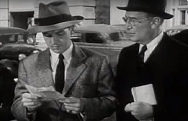 The refugee speaks to a spectator in this still from the film.