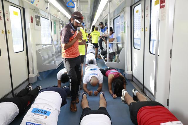 Participants on board the train, as they take the plank challenge. Participants on board the train, as they take the plank challenge.