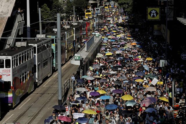 Thousands raise umbrellas during a rally to support young activists Joshua Wong, Nathan Law and Alex Chow in downtown Hong Kong on August 20, 2017. (AP Photo) Thousands raise umbrellas during a rally to support young activists Joshua Wong, Nathan Law and Alex Chow in downtown Hong Kong on August 20, 2017. (AP Photo)