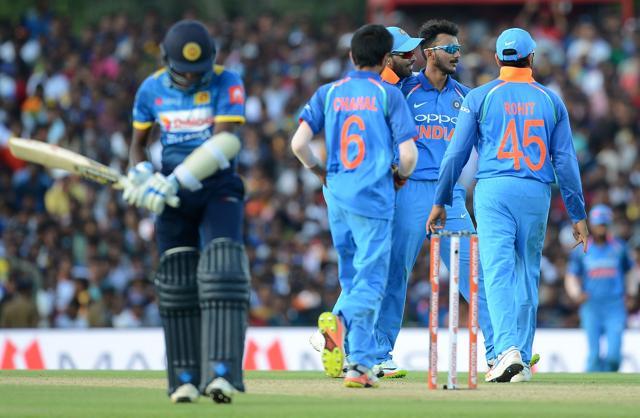 Axar Patel (2R) celebrates with his teammates after he dismissed Sri Lanka’sr Lakshan Sandakan. (AFP) Axar Patel (2R) celebrates with his teammates after he dismissed Sri Lanka’sr Lakshan Sandakan. (AFP)