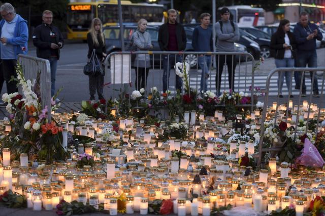 Candles and flowers have been left at the makeshift memorial for the victims of Friday's stabbings at the Turku Market Square, Finland on August 19, 2017. (AFP) Candles and flowers have been left at the makeshift memorial for the victims of Friday's stabbings at the Turku Market Square, Finland on August 19, 2017. (AFP)