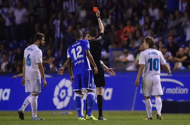 Sergio Ramos is shown a red card by the referee during the Spanish league football match RC Deportivo de la Coruna vs Real Madrid CF at the Municipal de Riazor stadium in La Coruna on August 20, 2017. Real Madrid won 3-0. (AFP)