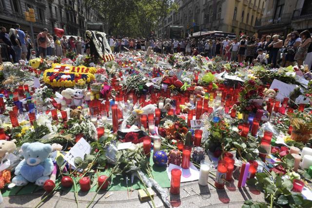 People display flowers, candles, balloons and many objects to pay tribute to the victims of the Barcelona and Cambrils attacks on the Rambla boulevard in Barcelona. (AFP) People display flowers, candles, balloons and many objects to pay tribute to the victims of the Barcelona and Cambrils attacks on the Rambla boulevard in Barcelona. (AFP)