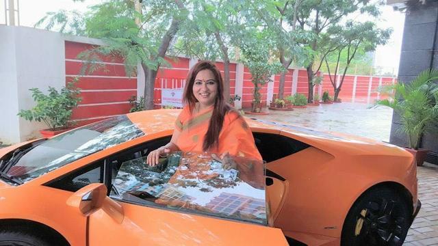 Mehta’s wife with Lamborghini. Mehta’s wife with Lamborghini.