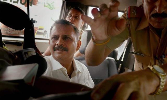 Lt Col Shrikant Prasad Purohit, who was granted bail by the Supreme Court on Monday in the 2008 Malegaon blast case, being taken to the Sessions Court from Taloja Jail in Navi Mumbai on Tuesday. (PTI Photo) Lt Col Shrikant Prasad Purohit, who was granted bail by the Supreme Court on Monday in the 2008 Malegaon blast case, being taken to the Sessions Court from Taloja Jail in Navi Mumbai on Tuesday. (PTI Photo)