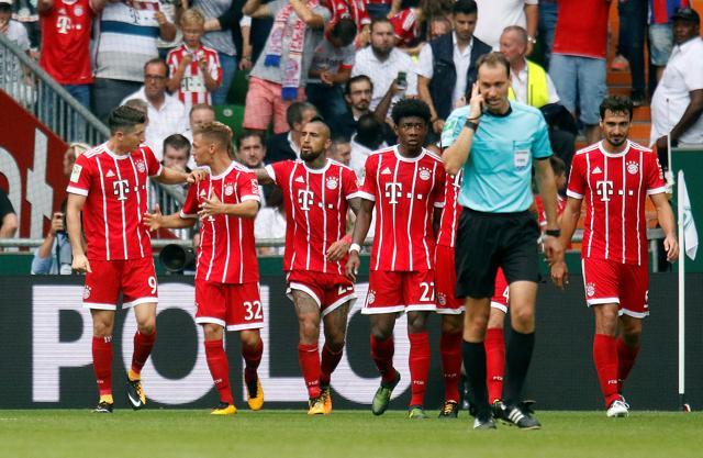 Bayern Munich's Robert Lewandowski celebrates scoring their first goal with Joshua Kimmich and team mates. (REUTERS) Bayern Munich's Robert Lewandowski celebrates scoring their first goal with Joshua Kimmich and team mates. (REUTERS)