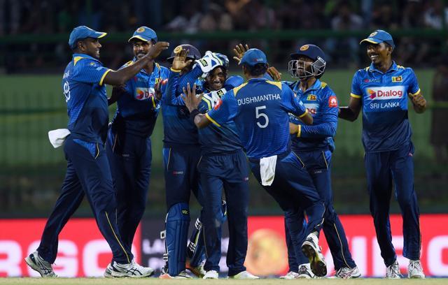Akila Dananjaya (C) celebrates with teammates after he dismissed India's Axar Patel during the second One Day International (ODI) cricket match between Sri Lanka and India. (AFP) Akila Dananjaya (C) celebrates with teammates after he dismissed India's Axar Patel during the second One Day International (ODI) cricket match between Sri Lanka and India. (AFP)