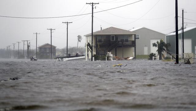 A home damaged by Hurricane Harvey remains surrounded by flood waters, Saturday, Aug. 26, 2017, in Rockport, Texas. (AP) A home damaged by Hurricane Harvey remains surrounded by flood waters, Saturday, Aug. 26, 2017, in Rockport, Texas. (AP)
