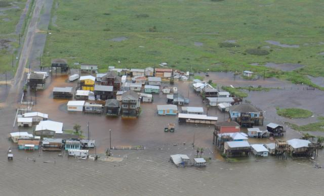 Housing surrounded by flood waters caused by Hurricane Harvey is seen from a US Coast Guard helicopter during an overflight from Port Aransas to Port O'Connor, Texas, August 26, 2017. (REUTERS) Housing surrounded by flood waters caused by Hurricane Harvey is seen from a US Coast Guard helicopter during an overflight from Port Aransas to Port O'Connor, Texas, August 26, 2017. (REUTERS)