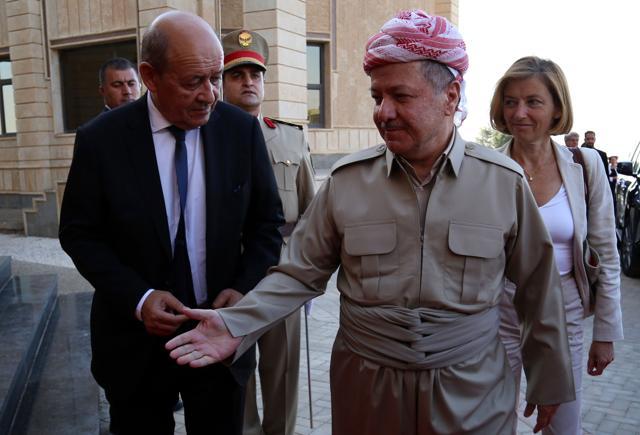 Iraq's Kurdistan region president Massud Barzani (C) welcomes French Foreign Affairs Minister Jean-Yves Le Drian (L) and French Defence Minister Florence Parly (R) ahead of their meeting on August 26, 2017, in Arbil, the capital of the Kurdish autonomous region in northern Iraq. (AFP)
