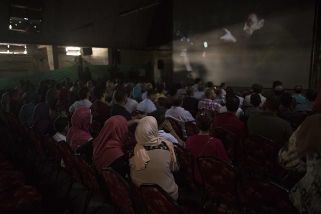 Palestinians attend the screening of 10 Years at Samer Cinema in Gaza City. (AFP) Palestinians attend the screening of 10 Years at Samer Cinema in Gaza City. (AFP)