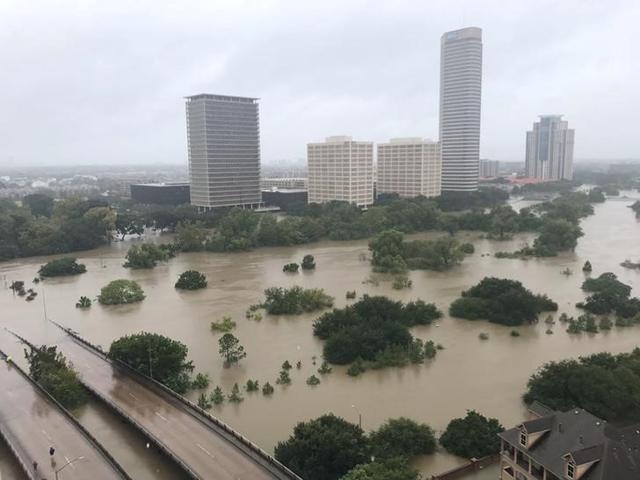 Flooded downtown is seen on Sunday from a high rise along Buffalo Bayou after Hurricane Harvey inundated the Texas Gulf coast with rain causing widespread flooding, in Houston. (Twitter/@caroleenarn via REUTERS ) Flooded downtown is seen on Sunday from a high rise along Buffalo Bayou after Hurricane Harvey inundated the Texas Gulf coast with rain causing widespread flooding, in Houston. (Twitter/@caroleenarn via REUTERS )