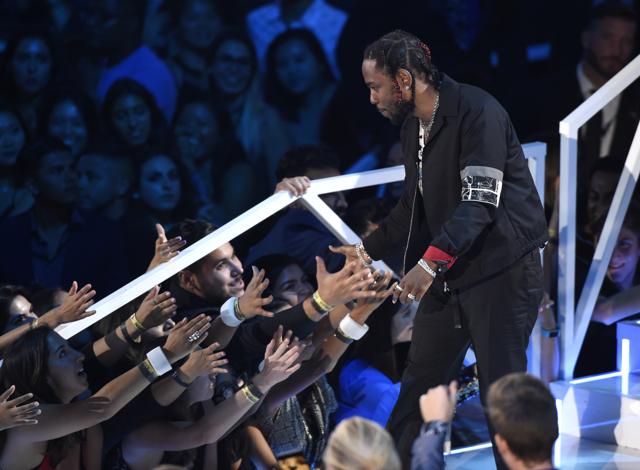 Kendrick Lamar walks on stage to accept the award for video of the year for "HUMBLE." (Chris Pizzello/Invision/AP) Kendrick Lamar walks on stage to accept the award for video of the year for "HUMBLE." (Chris Pizzello/Invision/AP)