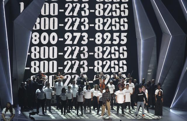 Khalid, from left, Logic, and Alessia Cara perform "1-800-273-8255" at the MTV Video Music Awards at The Forum on Sunday. (Matt Sayles/Invision/AP) Khalid, from left, Logic, and Alessia Cara perform "1-800-273-8255" at the MTV Video Music Awards at The Forum on Sunday. (Matt Sayles/Invision/AP)