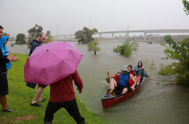 Houston residents use a kayak to rescue motorists stranded on Interstate highway 45 which is submerged from the effects of Hurricane Harvey. (REUTERS) Houston residents use a kayak to rescue motorists stranded on Interstate highway 45 which is submerged from the effects of Hurricane Harvey. (REUTERS)