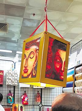 A paper lamp with Buddha image, costs Rs 280; STALL 12-11 D. (Henna Rakheja/HT Photo) A paper lamp with Buddha image, costs Rs 280; STALL 12-11 D. (Henna Rakheja/HT Photo)