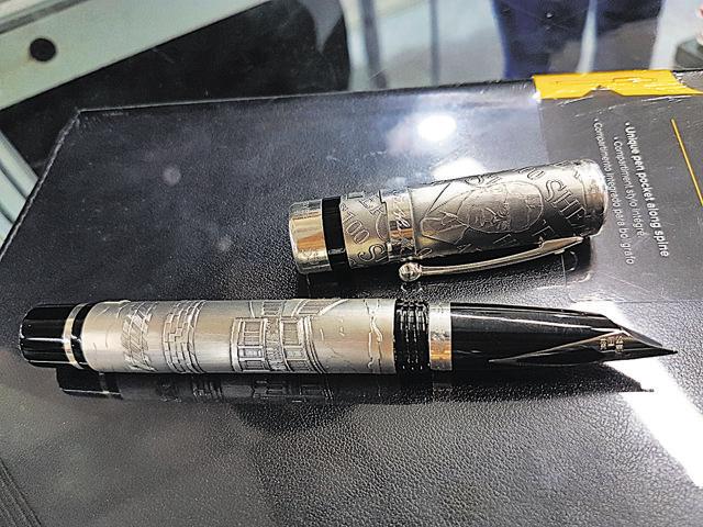 This is probably the most expensive pen displayed at the fair this year. Made out of silver, with engravings of the entire factory’s map on it, this Sheaffer’s pen priced at Rs 2.5 lakh is a rare beauty to spot; STALL 12-11. (Henna Rakheja/HT Photo) This is probably the most expensive pen displayed at the fair this year. Made out of silver, with engravings of the entire factory’s map on it, this Sheaffer’s pen priced at Rs 2.5 lakh is a rare beauty to spot; STALL 12-11. (Henna Rakheja/HT Photo)