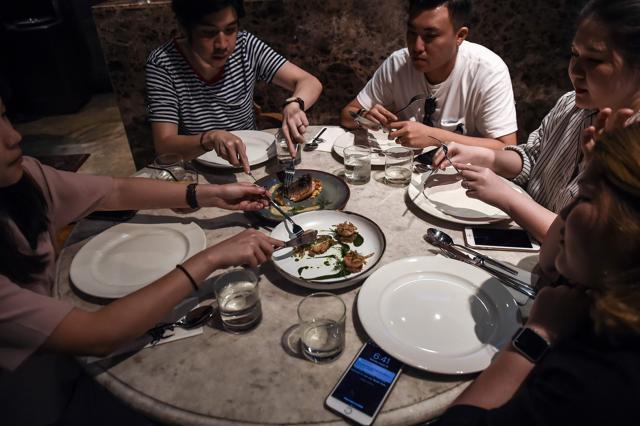 People eating insects in the Backyard, which says it offers the first insect-based fine-dining menu, in Bangkok. (AFP) People eating insects in the Backyard, which says it offers the first insect-based fine-dining menu, in Bangkok. (AFP)