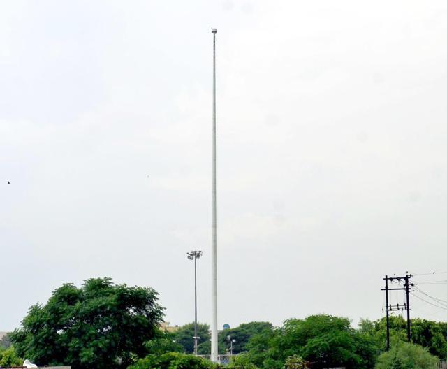 The 170-foot pole at Amrit Anand Park in Amritsar stands without its flag on Wednesday. (Sameer Sehgal/HT)