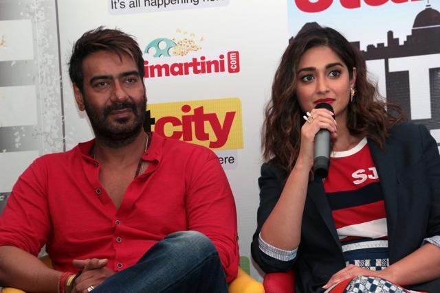 Ajay Devgn and Ileana D’Cruz answering questions asked by winners of the Stars in the City contest. (Photo: Shivam Saxena/HT)