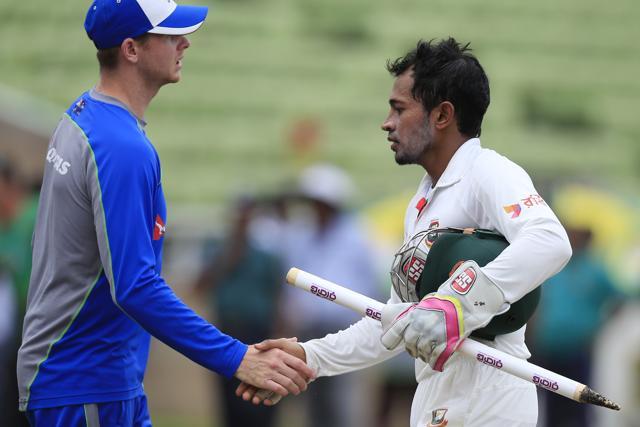 Bangladesh's cricket team captain Mushfiqur Rahim, right, shakes hands with Australian cricket team captain Steve Smith at the end of the fourth day of the first Test in Dhaka on Wednesday. (AP) Bangladesh's cricket team captain Mushfiqur Rahim, right, shakes hands with Australian cricket team captain Steve Smith at the end of the fourth day of the first Test in Dhaka on Wednesday. (AP)