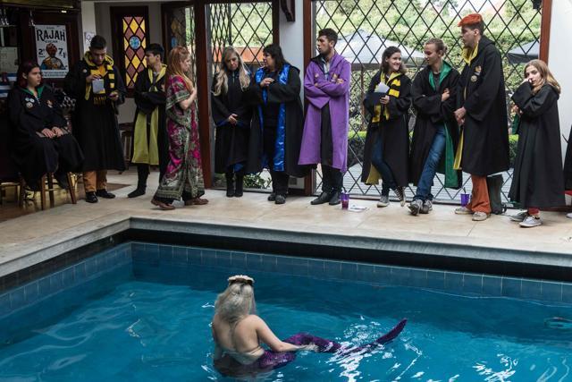 Students of the School of Magic and Witchcraft walk past a 'mermaid' in charge of the magical creatures class. (AFP Photo) Students of the School of Magic and Witchcraft walk past a 'mermaid' in charge of the magical creatures class. (AFP Photo)