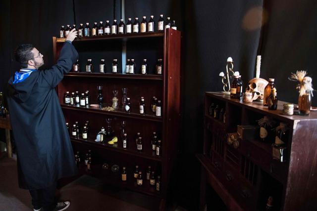 A student of the School of Magic and Witchcraft holds a potion in a castle. (AFP Photo) A student of the School of Magic and Witchcraft holds a potion in a castle. (AFP Photo)