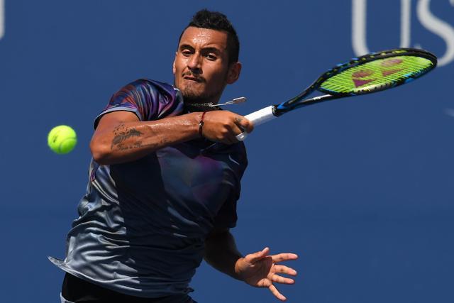 Australia's Nick Kyrgios returns the ball to Australia's John Millman during their US Open encounter. (AFP) Australia's Nick Kyrgios returns the ball to Australia's John Millman during their US Open encounter. (AFP)