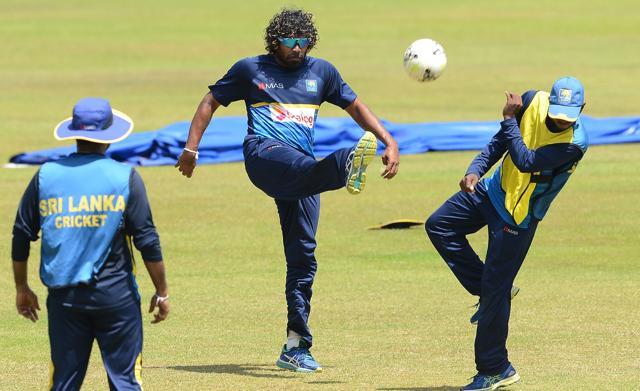 Lasith Malinga (C) plays football with teammates during a practice session at the R.Peremadasa Stadium in Colombo on August 30, 2017. (AFP) Lasith Malinga (C) plays football with teammates during a practice session at the R.Peremadasa Stadium in Colombo on August 30, 2017. (AFP)