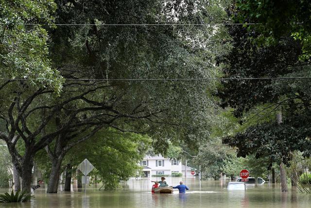 Residents in a neighbourhood near the Barker Reservoir return to their homes to collect belongings August 31, 2017 in Houston, Texas. The neighborhoods surrounding the reservoir are still experiencing severe flooding due to the accumulation of historic levels of rainfall, though floodwaters are beginning to recede in many parts of the city. (AFP) Residents in a neighbourhood near the Barker Reservoir return to their homes to collect belongings August 31, 2017 in Houston, Texas. The neighborhoods surrounding the reservoir are still experiencing severe flooding due to the accumulation of historic levels of rainfall, though floodwaters are beginning to recede in many parts of the city. (AFP)