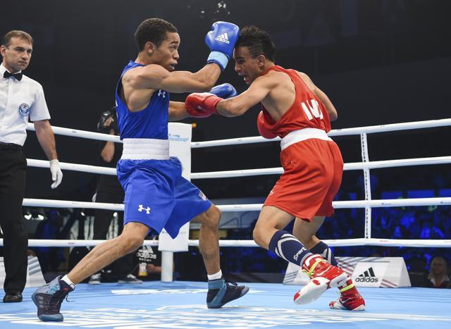 Duke Ragan, right, fights against Indian boxer Gaurav Bidhuri in the bantamweight class. (AP) Duke Ragan, right, fights against Indian boxer Gaurav Bidhuri in the bantamweight class. (AP)